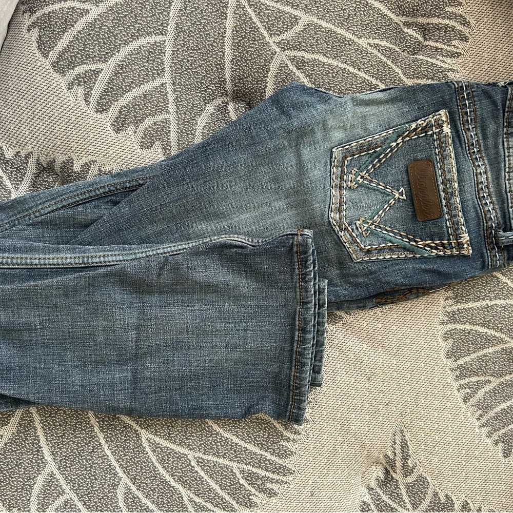 Wrangler Blue Boot Cut Jeans with Distressed Look